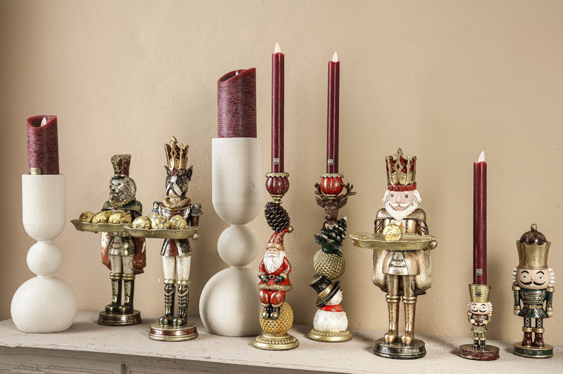 Denne Green poly nutcracker shaped statue on base